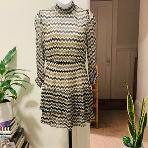 Long sleeved sheer mini dress with slip